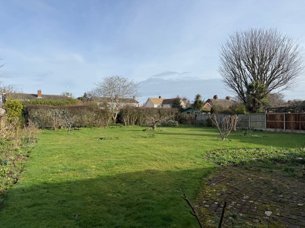 Lot: 155 - DETACHED BUNGALOW FOR IMPROVEMENT IN POPULAR LOCATION - Rear garden and patio area